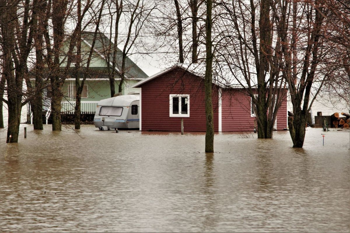 A house surrounded by floodwater after heavy rain