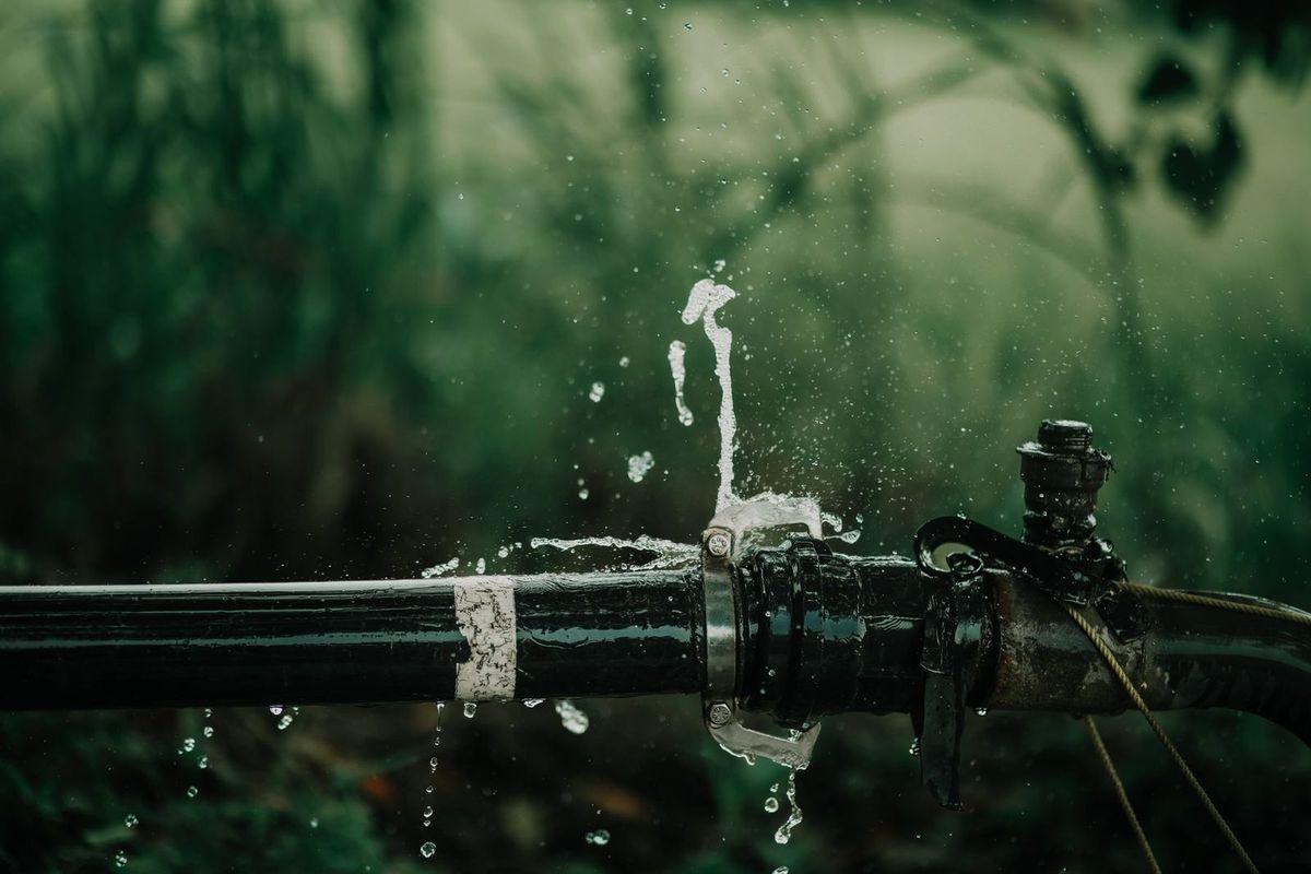 Water spraying from a split pipe